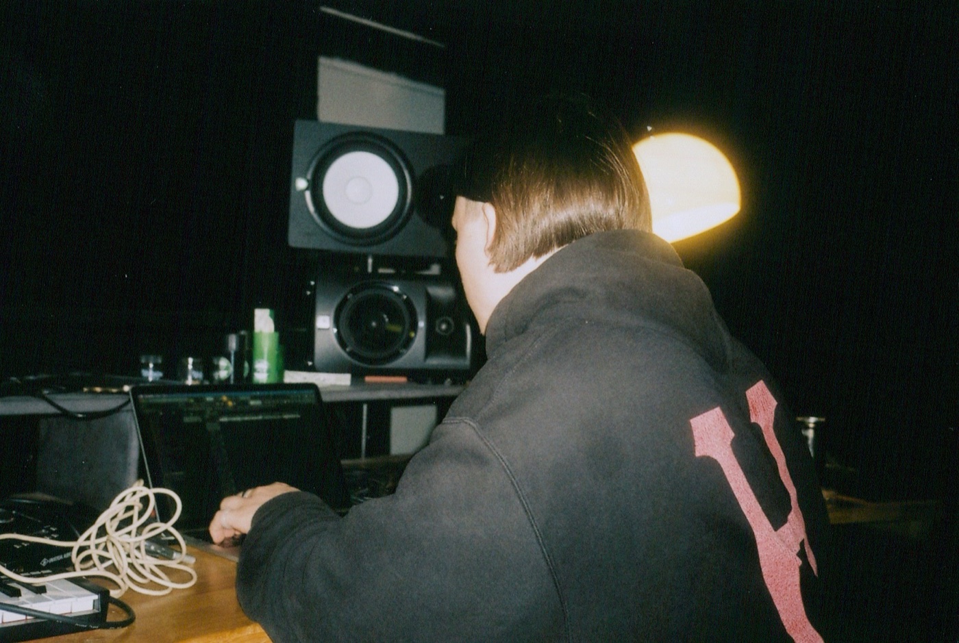 Razz, founder of RippleEdit, at the desk in the studio